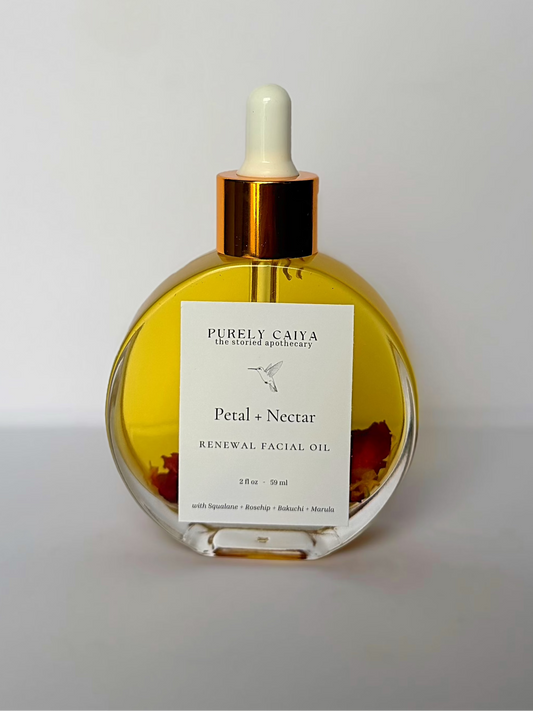 Facial oil bottle with dropper labeled 'Purely Caya' on a white background